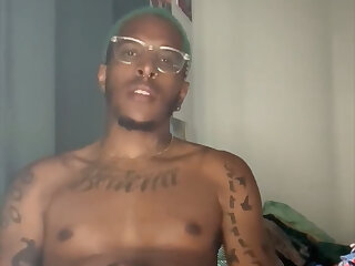 Handsome mixed dude strokes his curved dick.