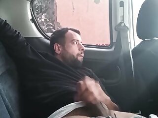 Turkish guy has huge cock and jerking off in car. People walking around on the street xxx He wants to fuck someone