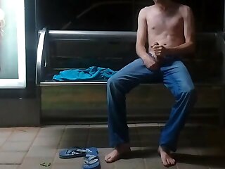 Guy shooting a huge load at the bus stop