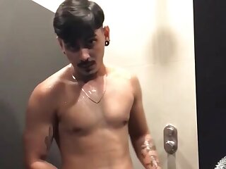 Horny guy jerks off while in the lockerroom