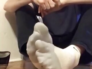 Rubbing my big, socked feet!