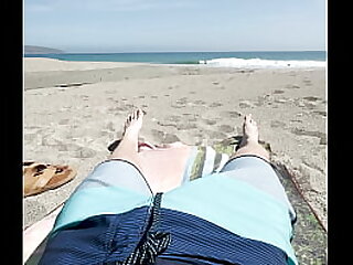 Teen jerks off on public beach